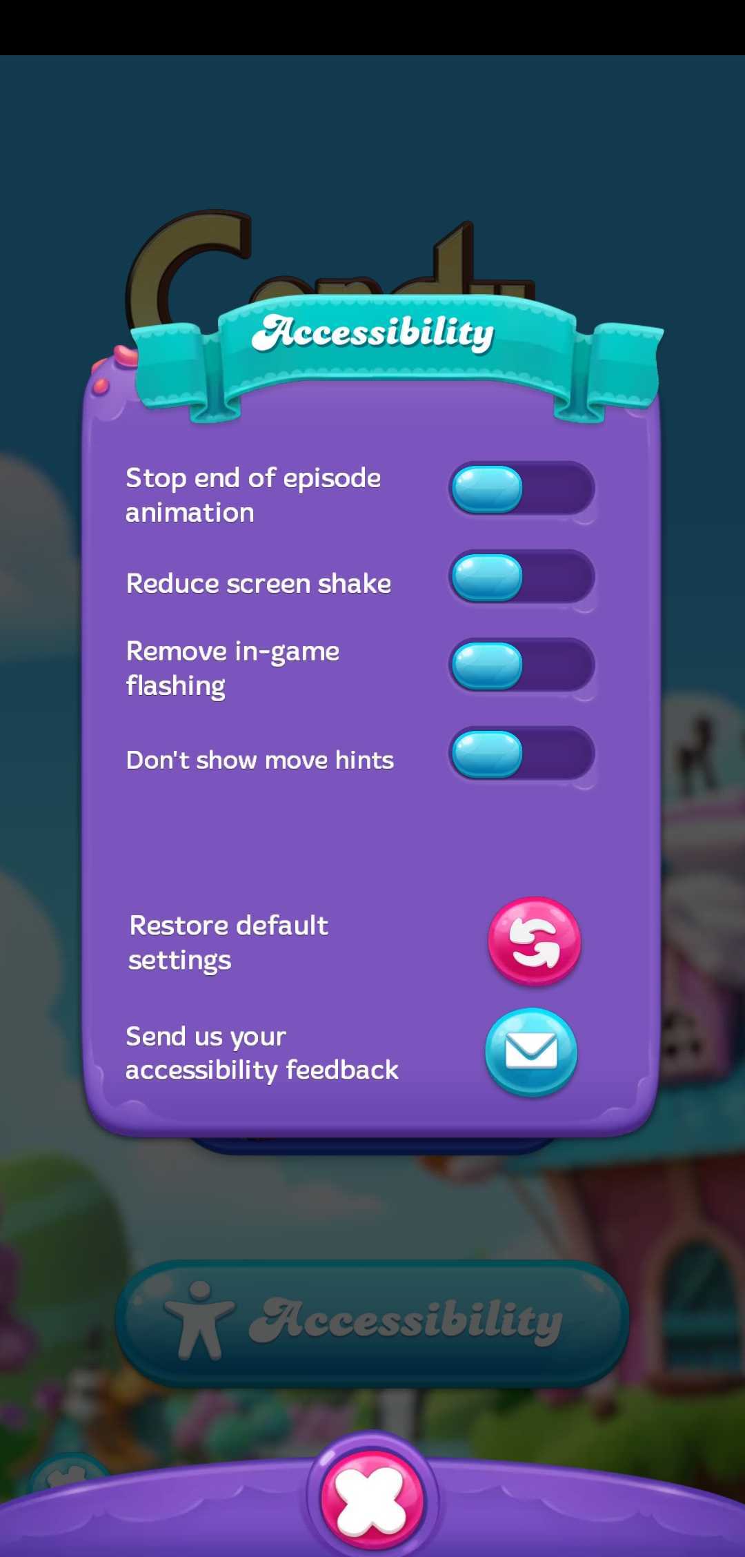 Accessibility options menu in 'Candy Crush Friends Saga' with toggles for stopping end of episode animation, reducing screen shake, removing in-game flashing, and deactivating hints, as well as buttons for restoring default settings and sending accessibility feedback.