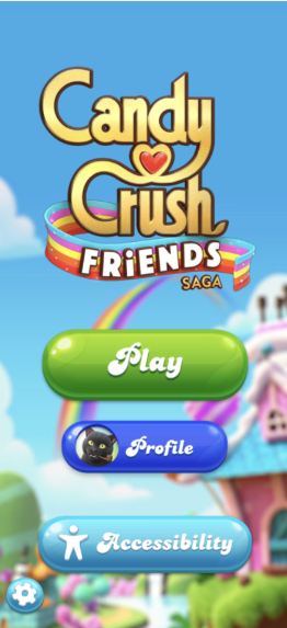 القائمة الرئيسية للعبة 'Candy Crush Friends Saga' تعرض خيارات 'Play' و'Profile' و'Accessibility' على خلفية خيالية بطابع الحلوى.